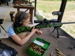 Emmie getting ready to match her big sister shooting the 300 ultra +P.jpg