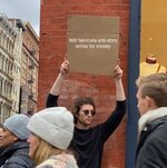 Guy-Holding-Cardboard-Sign~2.jpg